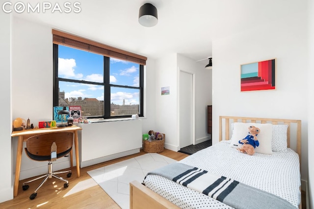 bedroom with light wood-type flooring