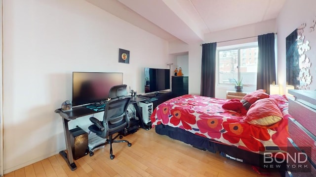 bedroom with hardwood / wood-style floors