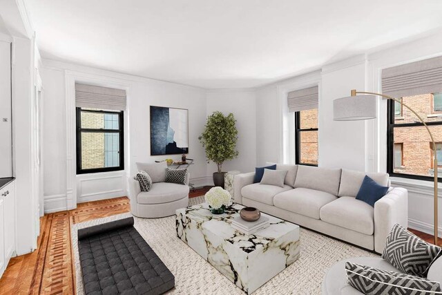 living room featuring light hardwood / wood-style floors and a wealth of natural light