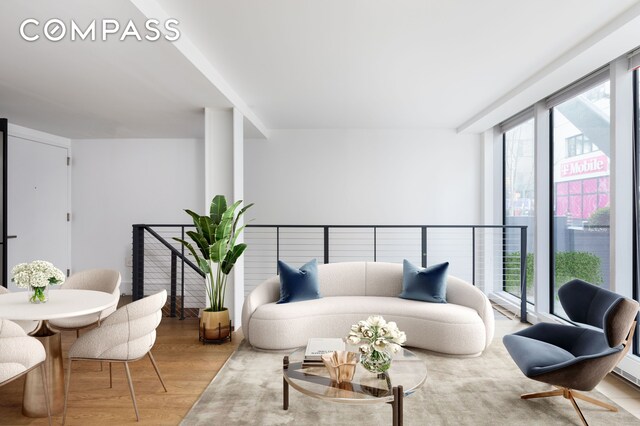 living room featuring a healthy amount of sunlight and wood finished floors