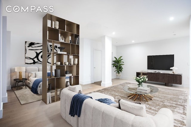 living room featuring light wood-style floors and recessed lighting