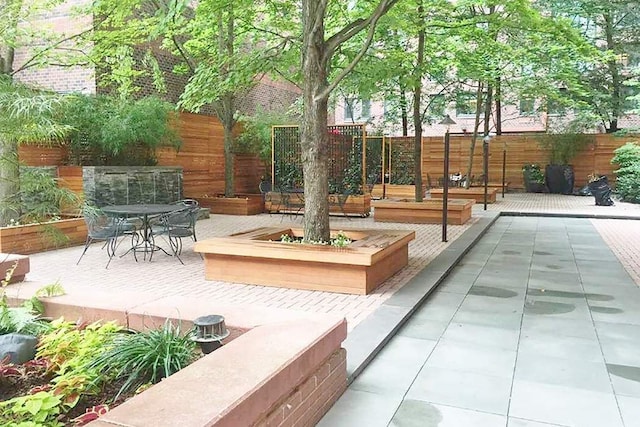 view of patio featuring outdoor dining space and a fenced backyard