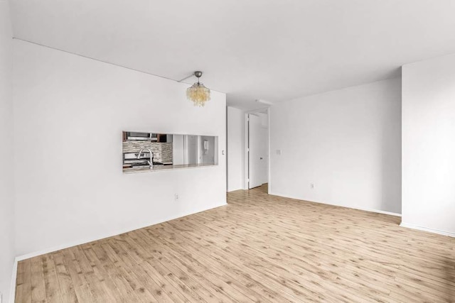 spare room featuring wood finished floors