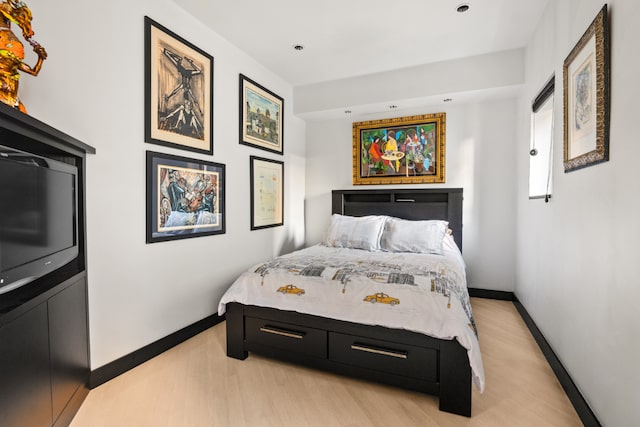 bedroom with light hardwood / wood-style floors