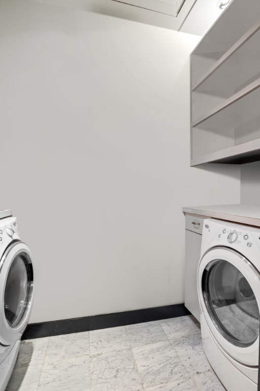 laundry room with washing machine and clothes dryer