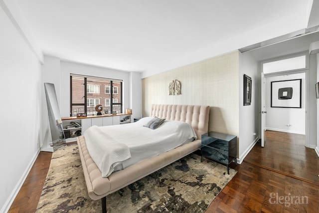 bedroom with parquet flooring and baseboards