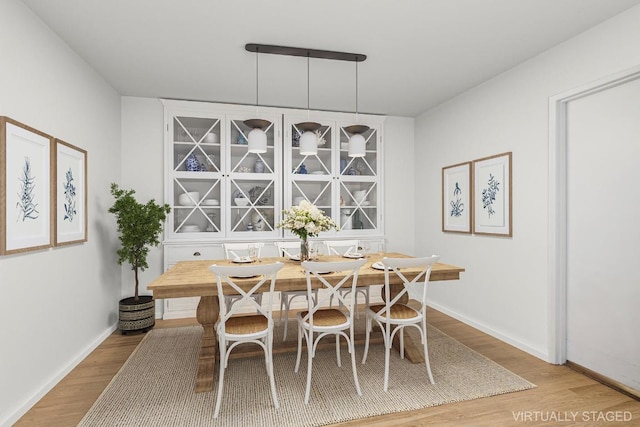 dining space featuring light hardwood / wood-style flooring