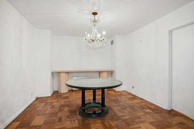 dining area with baseboards, a notable chandelier, and visible vents