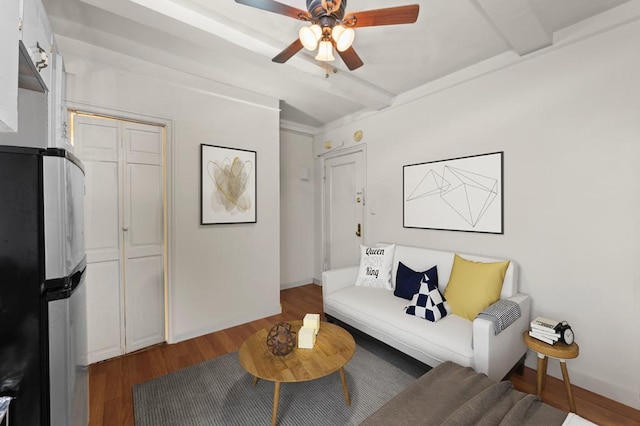 325 W 45th St Unit 403-A, New York City, NY 10036 - living room featuring wood finished floors, ceiling fan, and baseboards