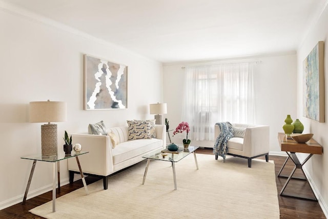 living room featuring hardwood / wood-style flooring and ornamental molding