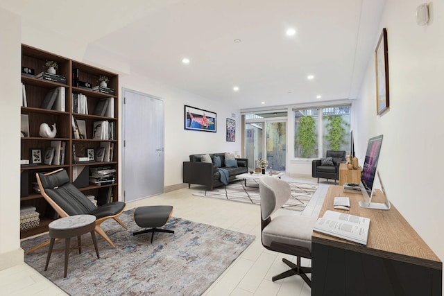 home office featuring light wood-style flooring and recessed lighting