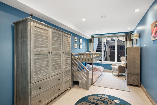 bedroom with light wood-style flooring, baseboards, and recessed lighting