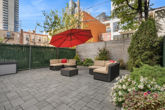 view of patio / terrace featuring a fenced backyard and an outdoor living space