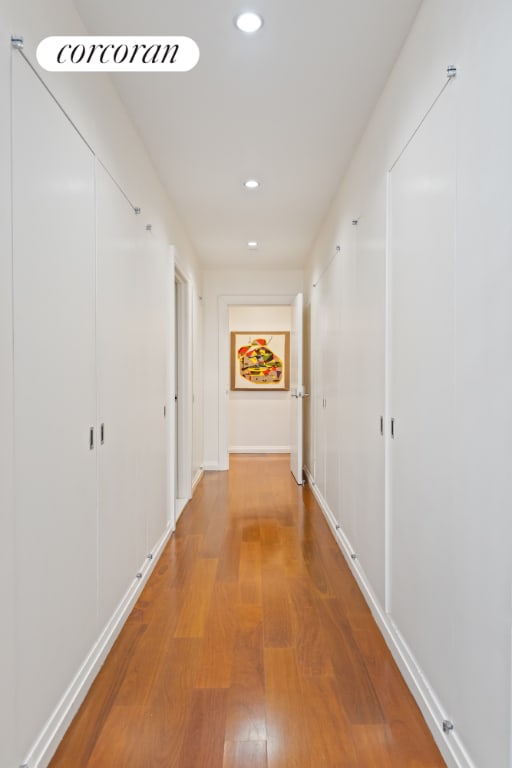 corridor featuring hardwood / wood-style floors