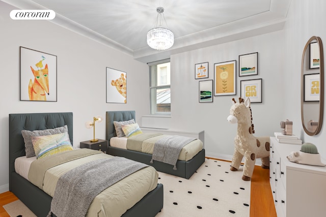 bedroom with crown molding and a chandelier