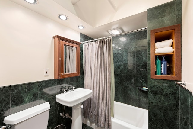 210 Spring St Unit 5Fl, New York City, NY 10013 - full bathroom with tile walls, shower / bath combo with shower curtain, toilet, and recessed lighting