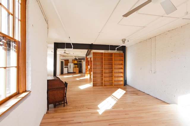 210 Spring St Unit 5Fl, New York City, NY 10013 - unfurnished living room featuring wood finished floors and a ceiling fan