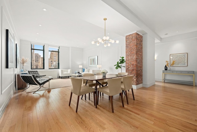 dining space featuring an inviting chandelier, recessed lighting, and light wood-style floors