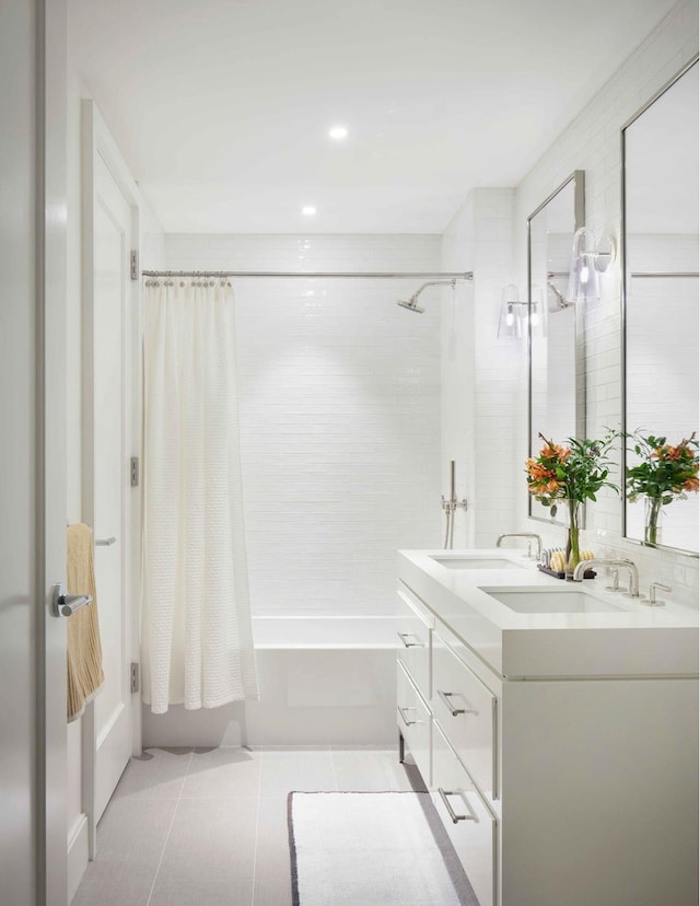 full bathroom with shower / bath combo with shower curtain, tile patterned floors, double vanity, and recessed lighting