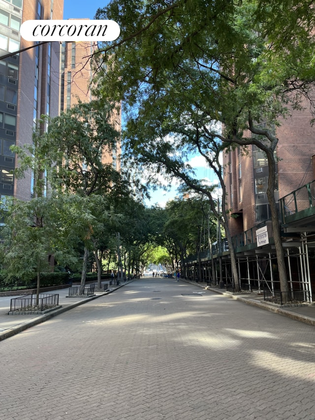 exterior space featuring curbs and sidewalks