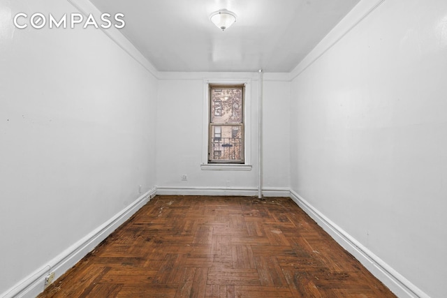 empty room featuring baseboards