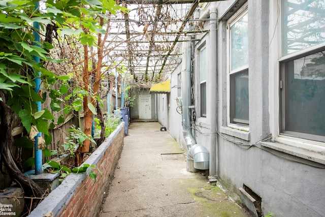 view of side of home featuring fence