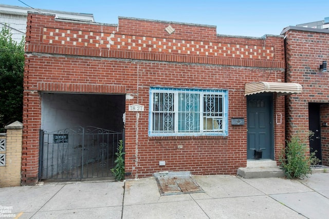 view of front of property featuring brick siding