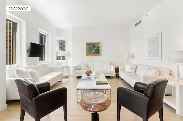 living room featuring visible vents