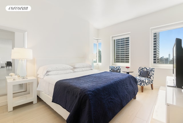 bedroom with visible vents and light wood finished floors