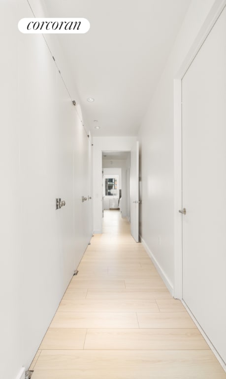 hall with light wood-style floors