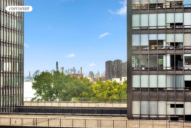 exterior space with a view of city and fence