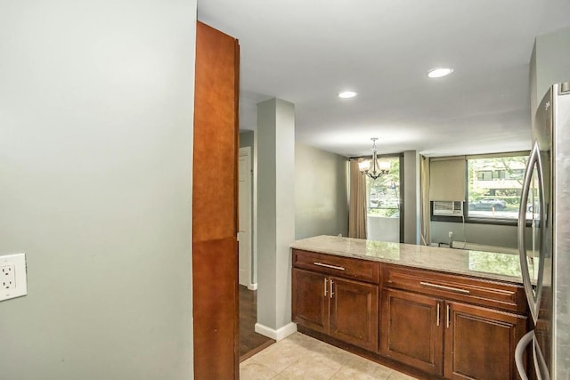 bathroom with tile patterned flooring and a notable chandelier