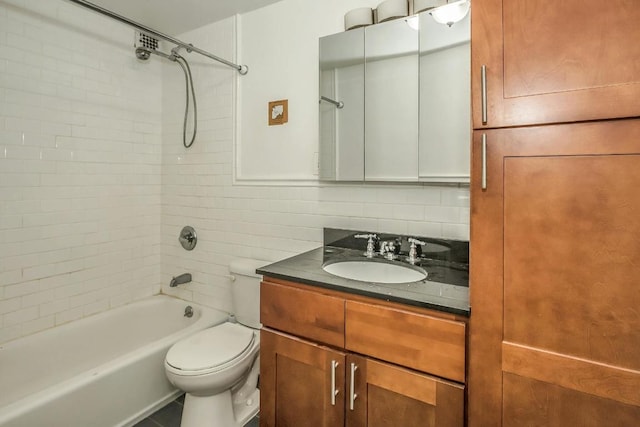 full bathroom with toilet, vanity, decorative backsplash, and tiled shower / bath