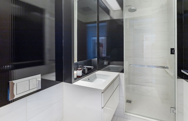 full bath featuring a stall shower and vanity