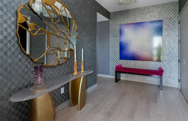 dining room with a notable chandelier and light wood-type flooring