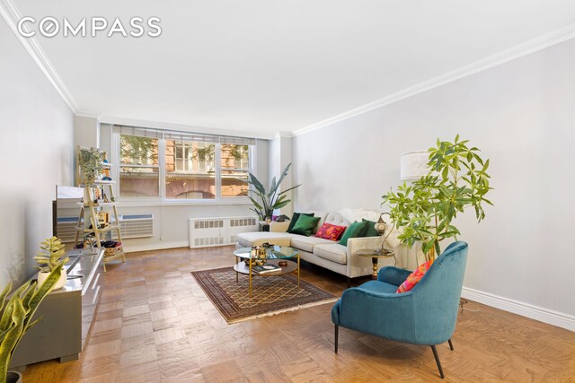 living room with crown molding, radiator heating unit, and parquet flooring