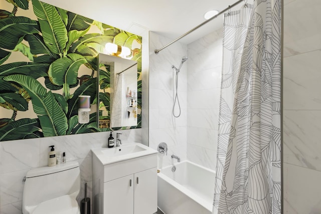 full bathroom featuring toilet, shower / bath combo, tile walls, and vanity