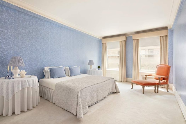 bedroom featuring crown molding and carpet flooring