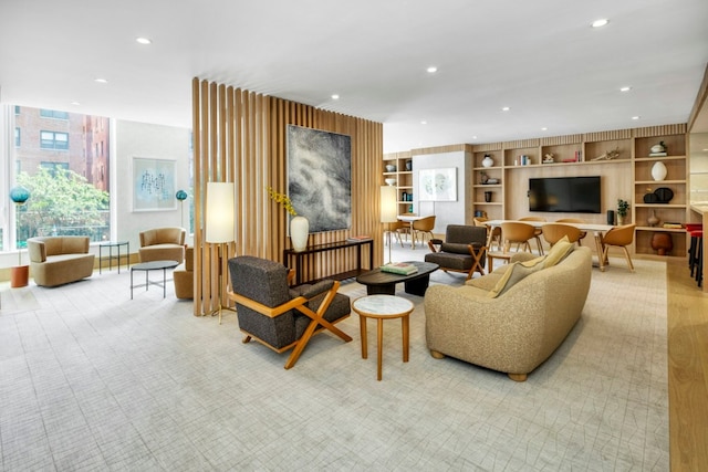 living room with built in features and light colored carpet