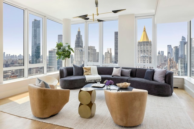 sunroom / solarium featuring a healthy amount of sunlight and a city view