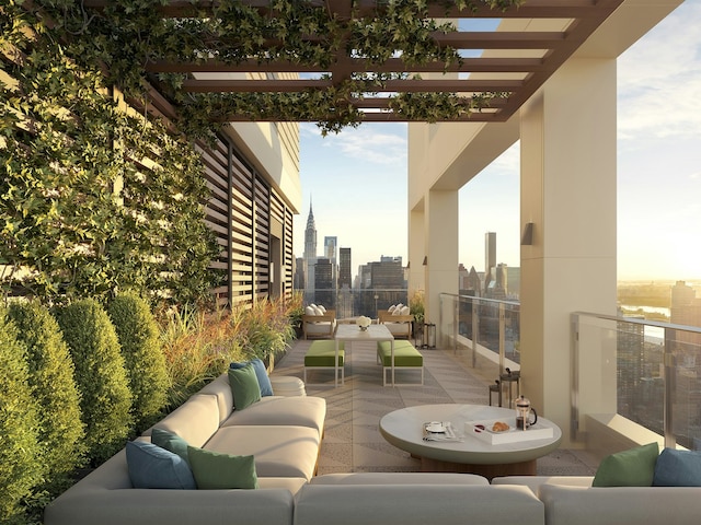 view of patio with a view of city, outdoor lounge area, and a balcony