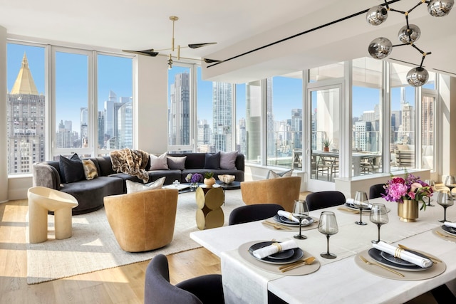 368 3rd Ave Pha, Pha, New York City, NY 10016 - dining area featuring a view of skyline, wood finished floors, and plenty of natural light