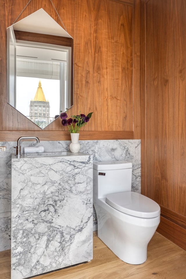 368 3rd Ave Pha, Pha, New York City, NY 10016 - half bathroom with wood finished floors, toilet, and a sink