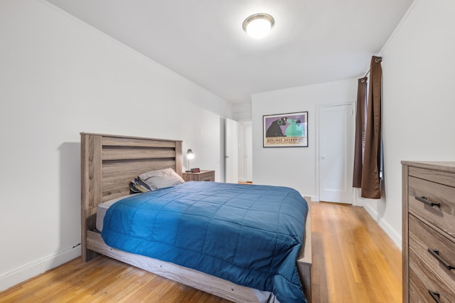 bedroom with hardwood / wood-style floors