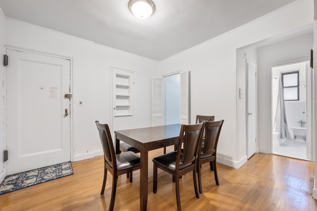 dining room with light wood-type flooring