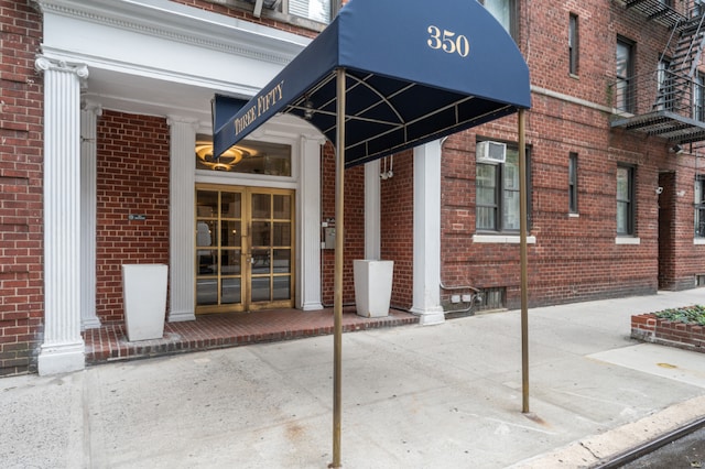 entrance to property featuring a wall mounted AC