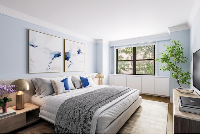 bedroom featuring ornamental molding and wood finished floors