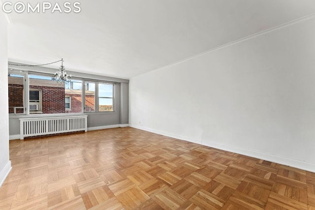 unfurnished room with radiator and light parquet flooring