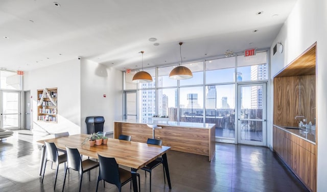 dining space featuring a wall of windows