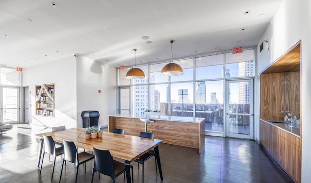 75 Wall St Unit 26A, New York City, NY 10005 - dining area with a wall of windows and a city view